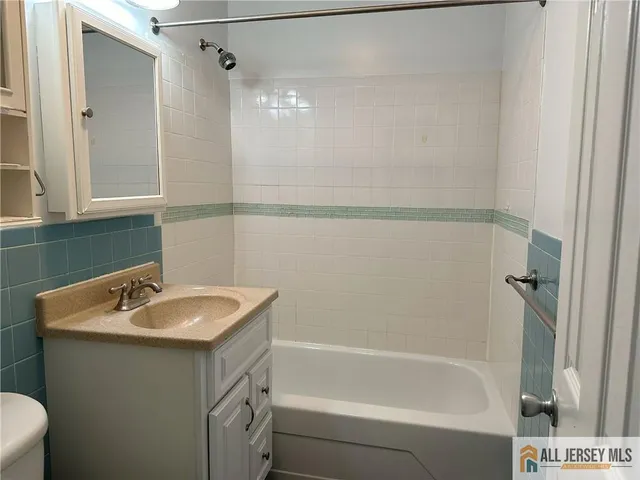 a bathroom with a sink and a bathtub