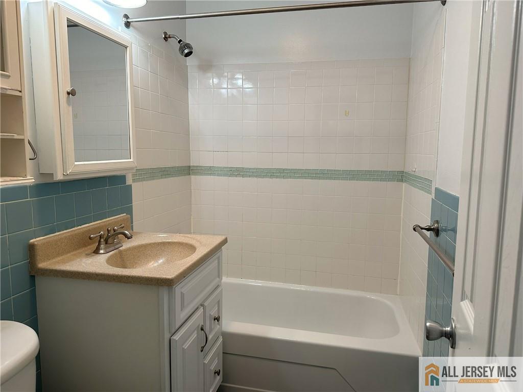 2 Lake Avenue, Unit 7B East Brunswick, NJ 08816 - Photo 10 of 10 a bathroom with a sink and a bathtub