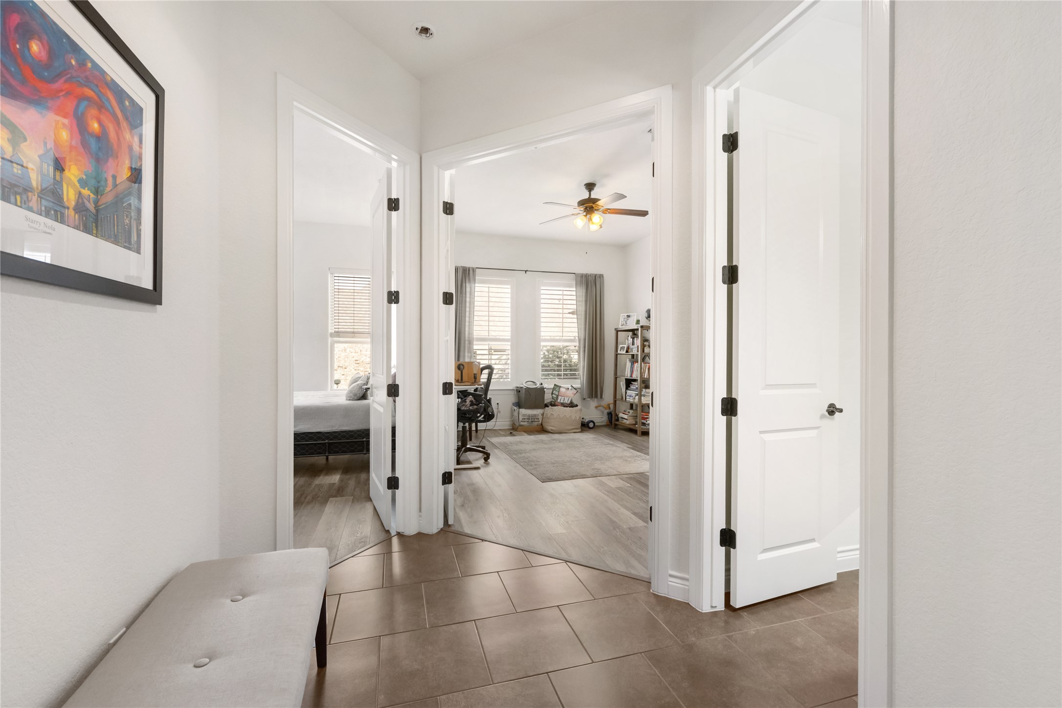 415 Bitterroot Lane Austin, TX 78737 - Photo 13 of 25 A well-lit hallway with durable tile flooring transitions smoothly into inviting interior spaces.