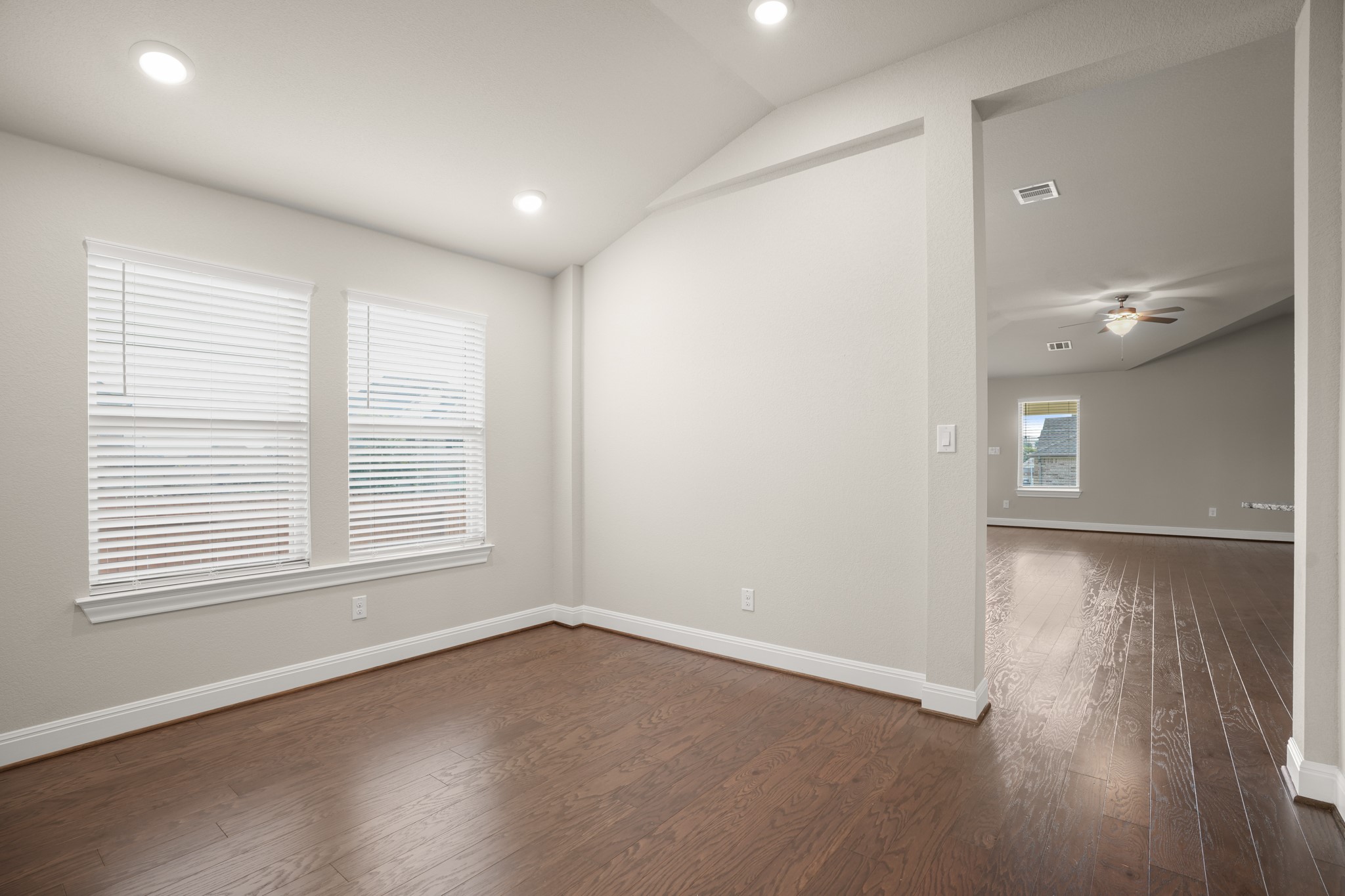 2209 Hat Bender Loop Round Rock, TX 78664 - Photo 8 of 25 an empty room with wooden floor and windows