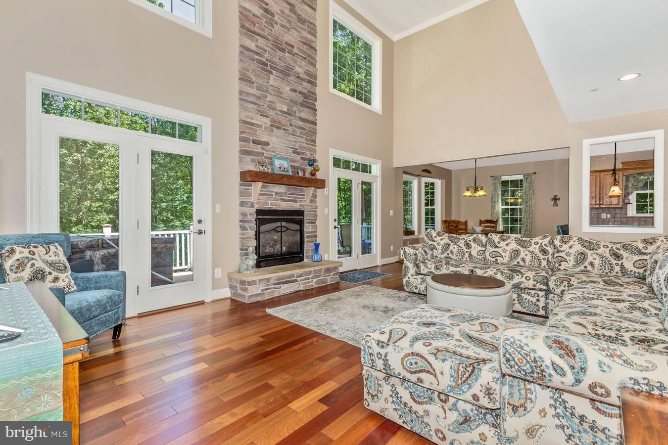 4033 Salem Bottom Road Westminster, MD 21157 - Photo 6 of 30 LR w/ floor to ceiling fireplace. cherry wood flrs