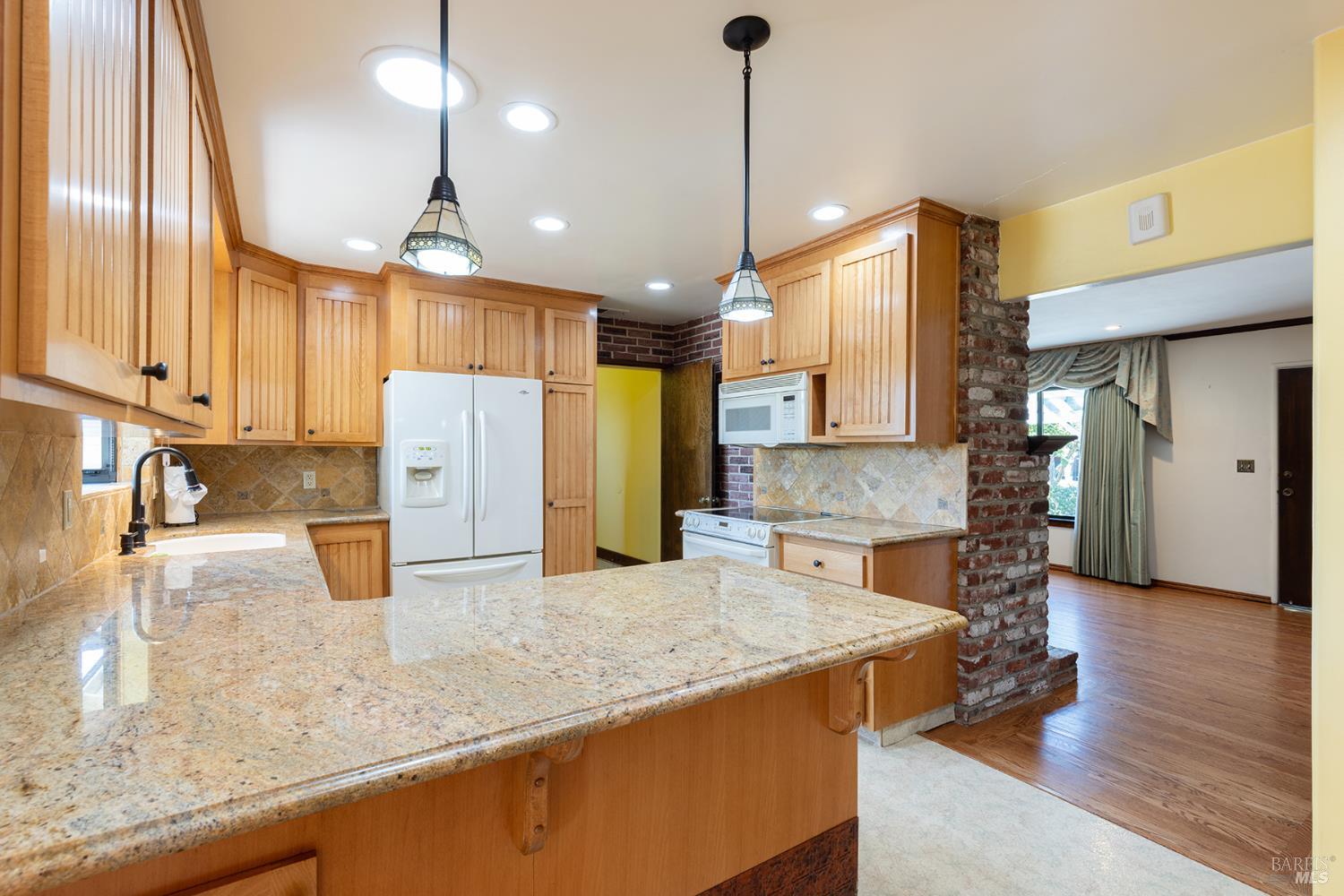 2236 West Hearn Avenue Santa Rosa, CA 95407 - Photo 18 of 56 a kitchen with stainless steel appliances granite countertop a sink a stove and a wooden floors
