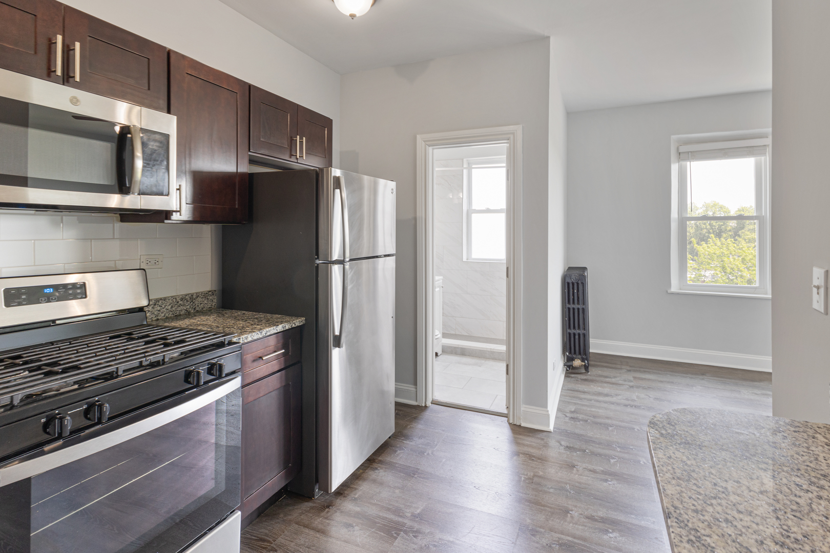 1608 West Sherwin Avenue, Unit 608 Chicago, IL 60626 - Photo 2 of 13 a kitchen with a stove and a refrigerator