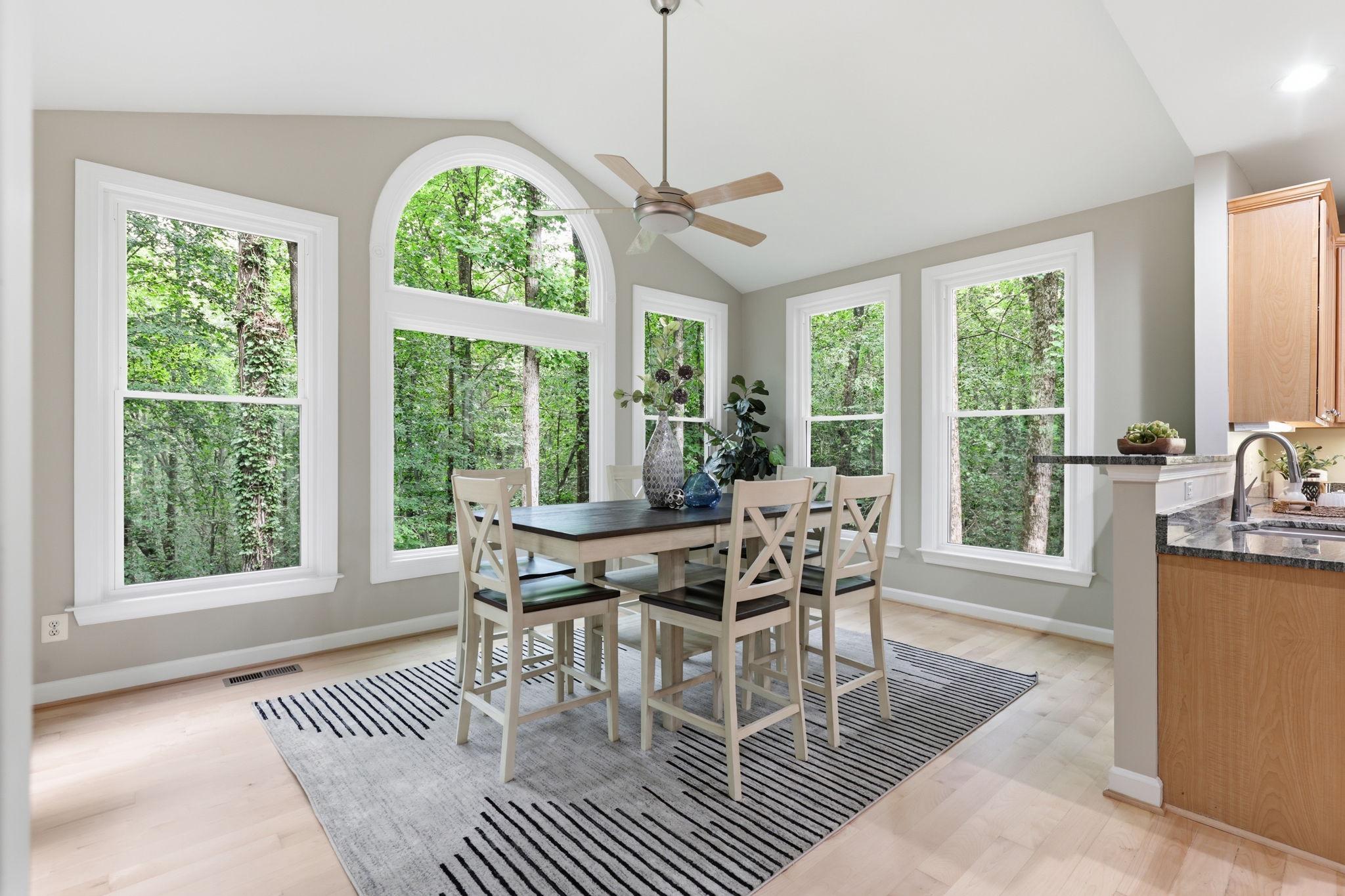 11509 Summit Ridge Court Manassas, VA 20112 - Photo 20 of 43 a dining room with furniture a chandelier and wooden floor