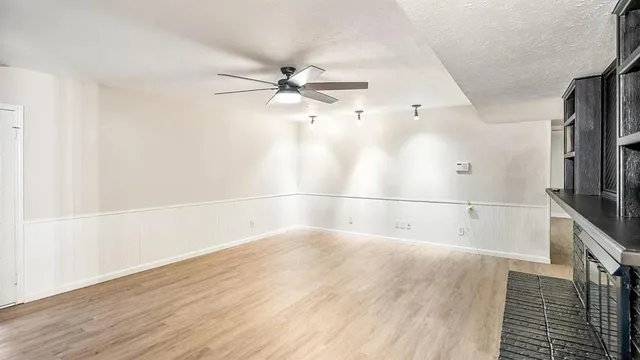 a view of a big room with wooden floor