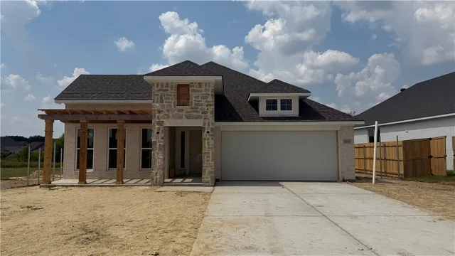 a front view of a house with yard