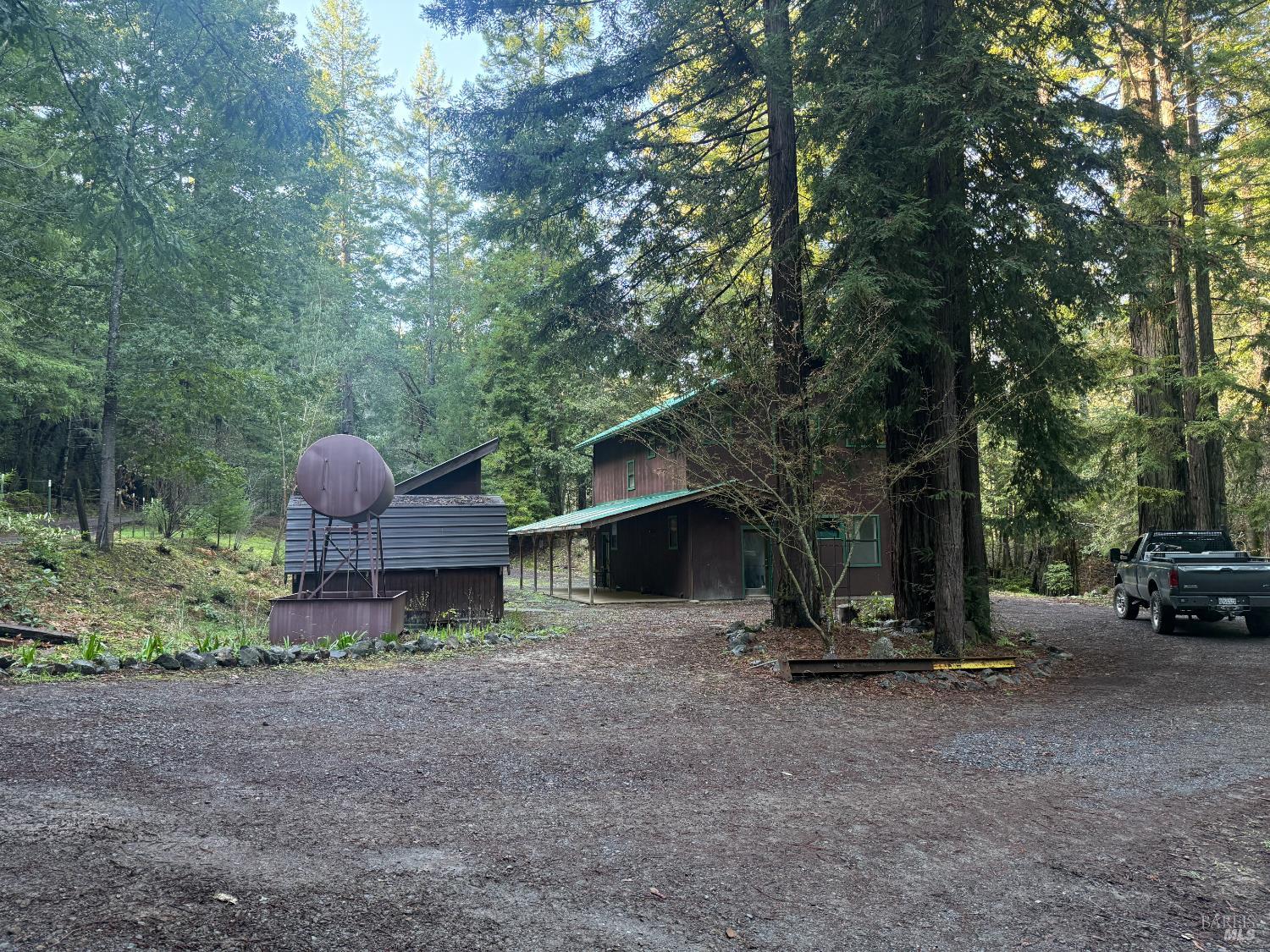 17001 Walker Lake Road Willits, CA 95490 - Photo 12 of 37 a view of a house with backyard and a tree
