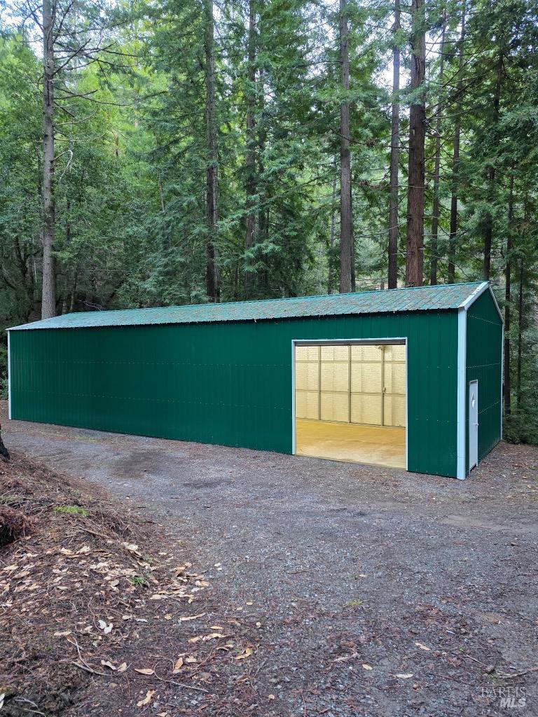 17001 Walker Lake Road Willits, CA 95490 - Photo 15 of 37 a view of a house with a backyard and a forest