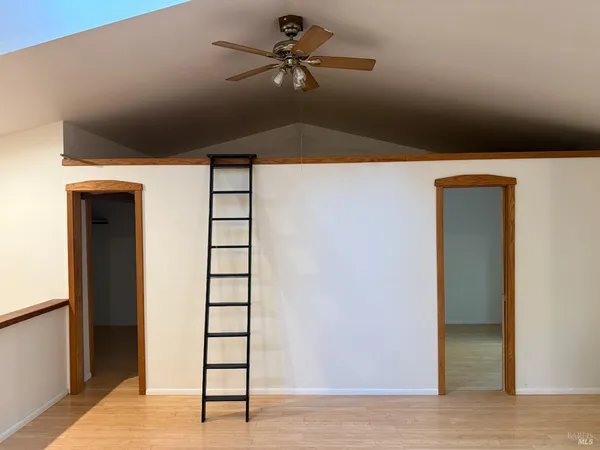 a very nice looking room with a ceiling fan