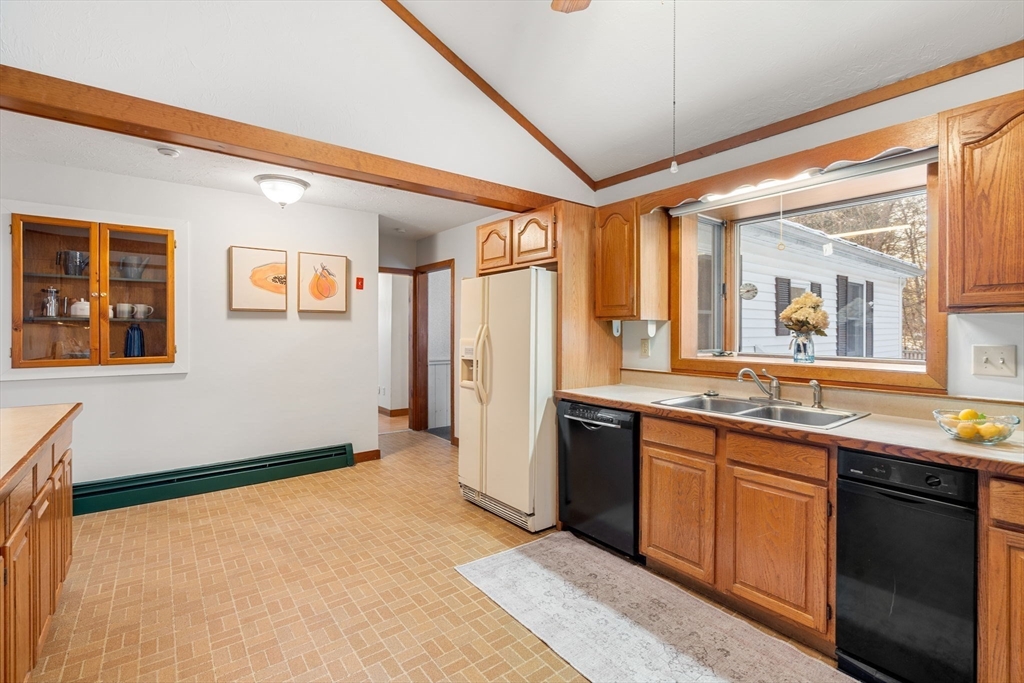 337 Sterling Road Lancaster, MA 01523 - Photo 4 of 41 a kitchen with stainless steel appliances granite countertop a refrigerator and a sink