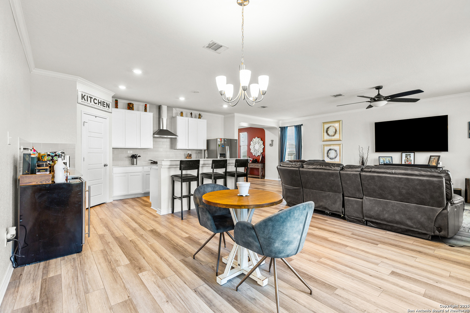 5205 Nature Marion, TX 78124 - Photo 13 of 45 a living room with furniture a flat screen tv and kitchen view