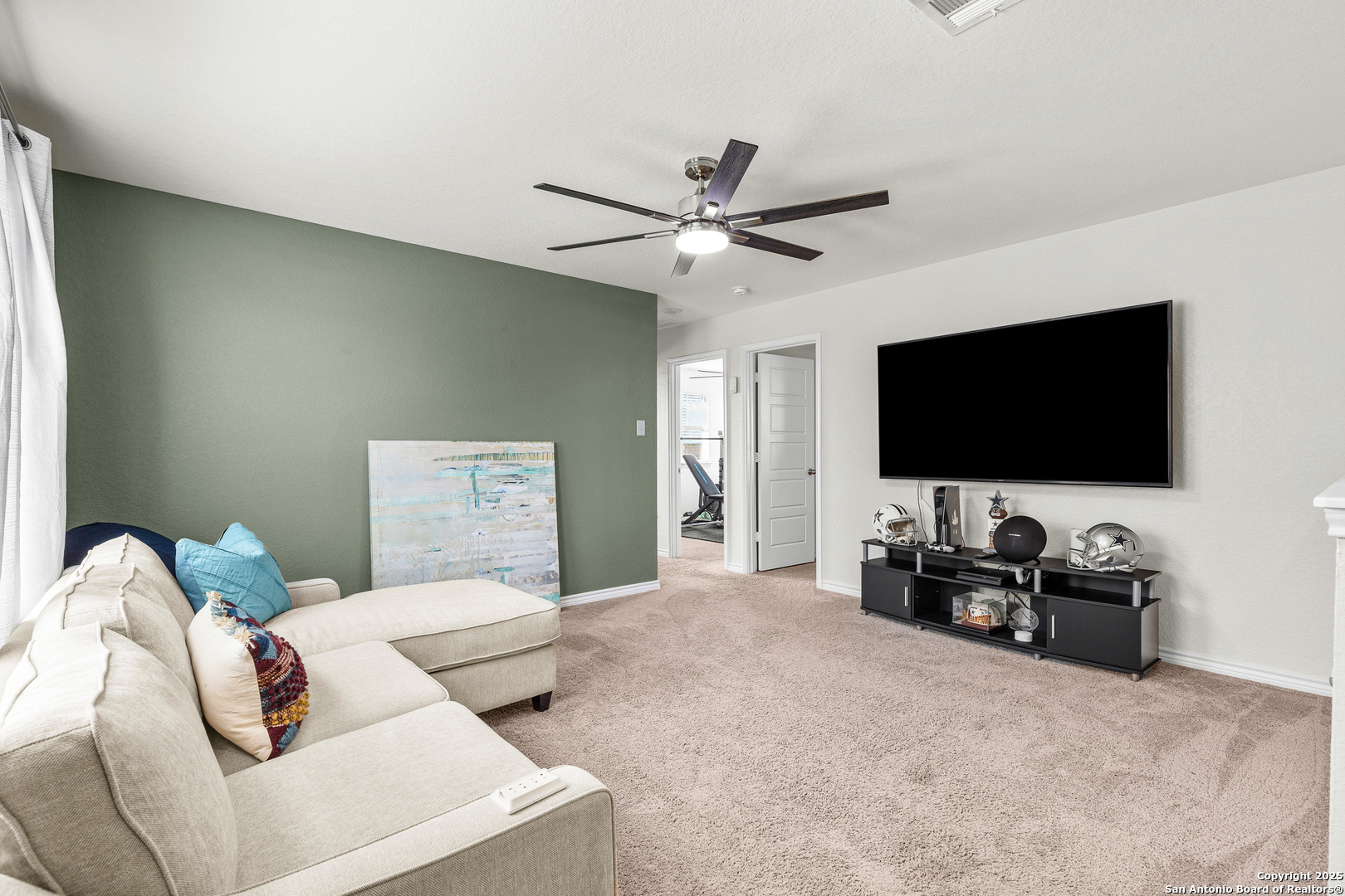 5205 Nature Marion, TX 78124 - Photo 17 of 45 a living room with furniture and a flat screen tv