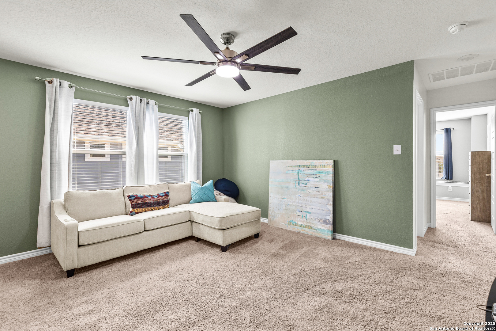 5205 Nature Marion, TX 78124 - Photo 18 of 45 a living room with furniture and a large window