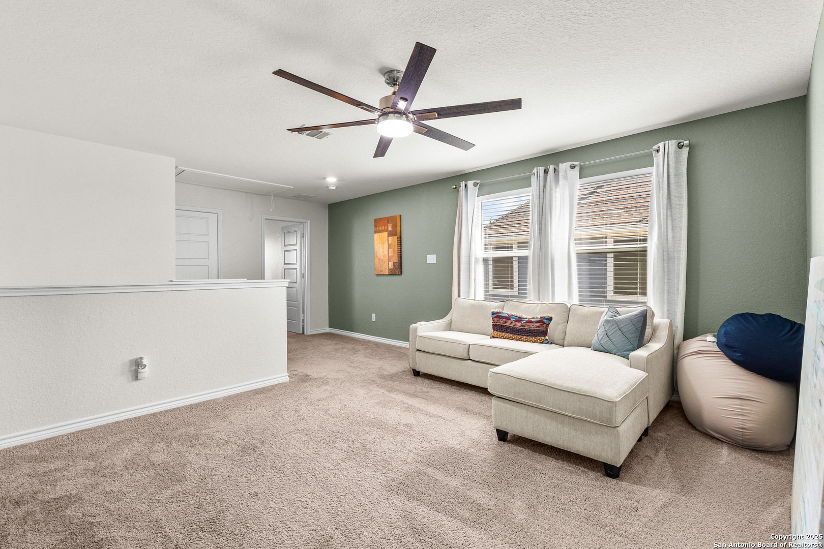 5205 Nature Marion, TX 78124 - Photo 19 of 45 a living room with furniture and a large window