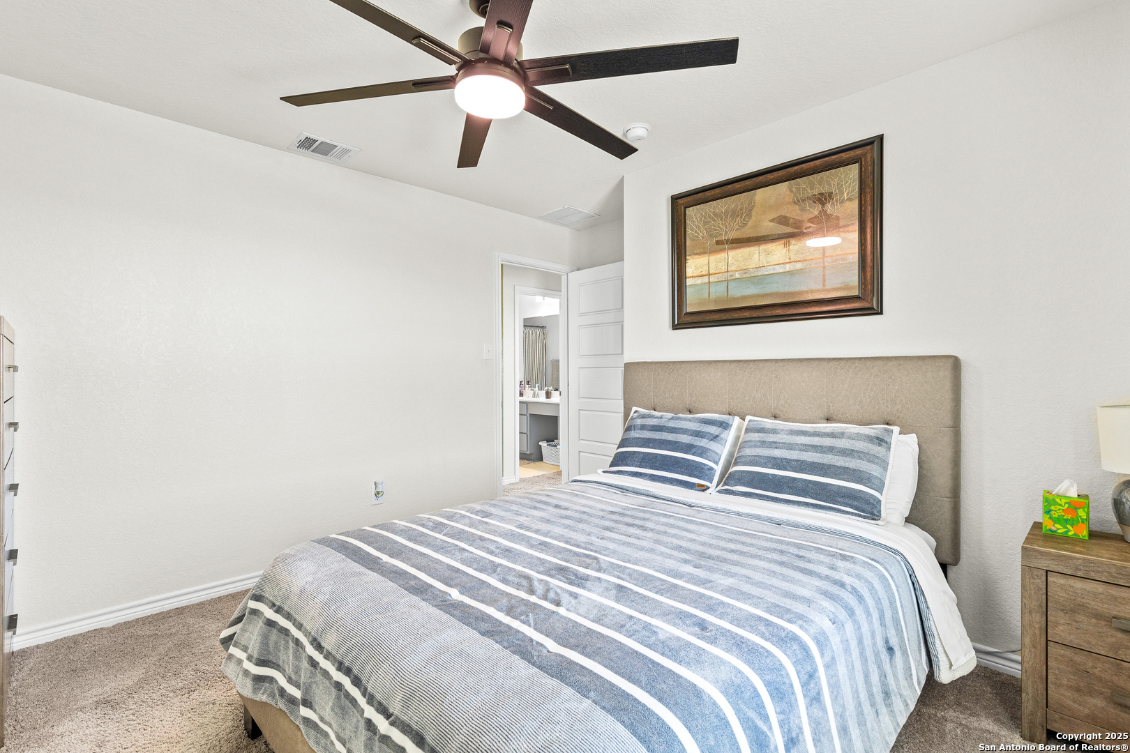 5205 Nature Marion, TX 78124 - Photo 24 of 45 a bedroom with a bed and a painting on the wall