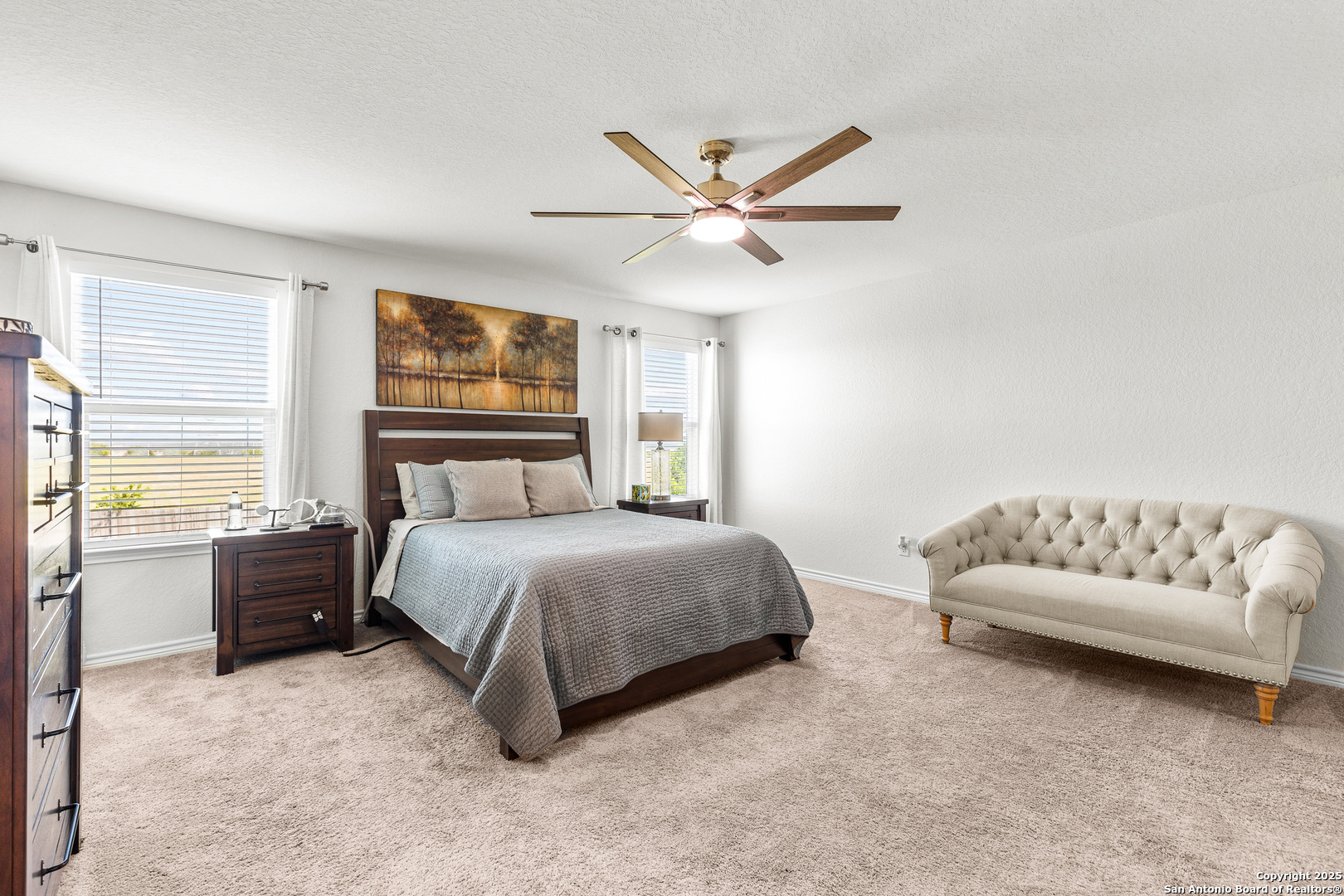 5205 Nature Marion, TX 78124 - Photo 27 of 45 a spacious bedroom with a bed and a couch
