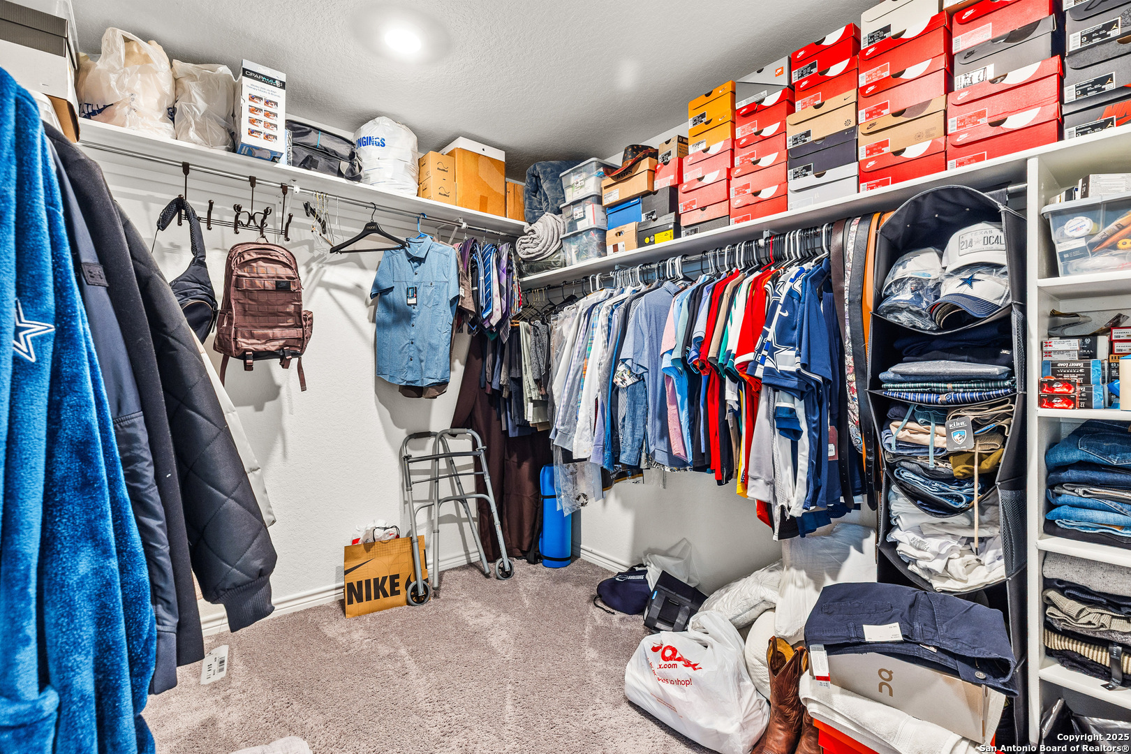 5205 Nature Marion, TX 78124 - Photo 28 of 45 a view of walk in closet with clothes and shoes