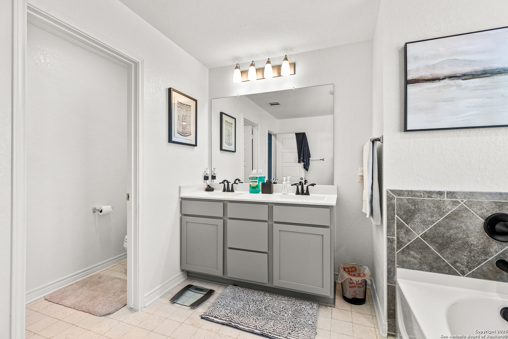 5205 Nature Marion, TX 78124 - Photo 30 of 45 a spacious bathroom with a sink mirror vanity and toilet