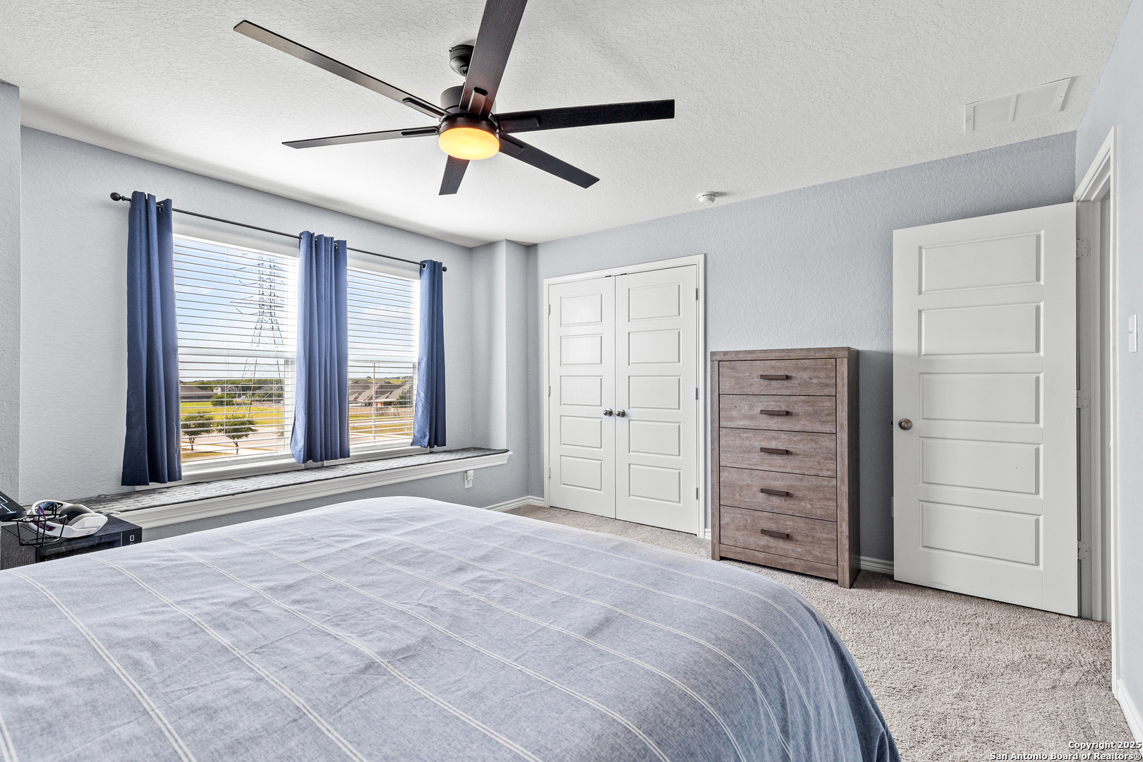 5205 Nature Marion, TX 78124 - Photo 32 of 45 a bedroom with a bed and a window