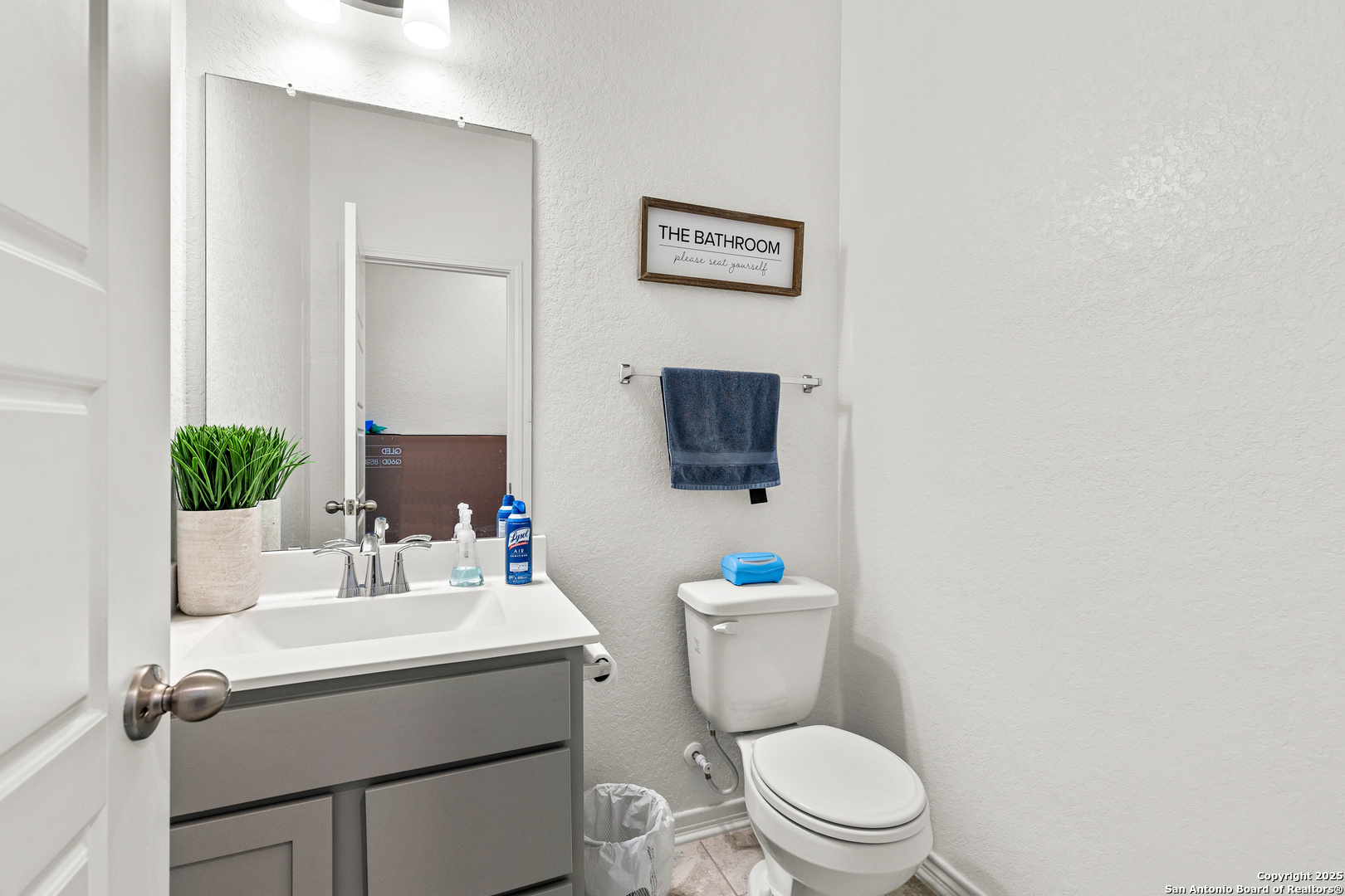 5205 Nature Marion, TX 78124 - Photo 34 of 45 a bathroom with a toilet a sink and mirror