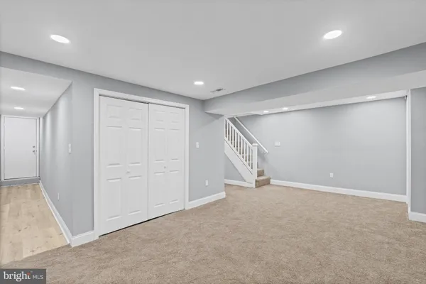 a view of kitchen with stainless steel appliances granite countertop refrigerator stove microwave and oven
