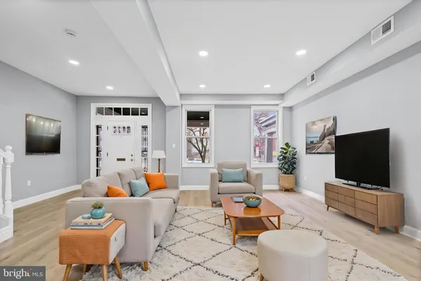 a bedroom with a bed and a potted plant