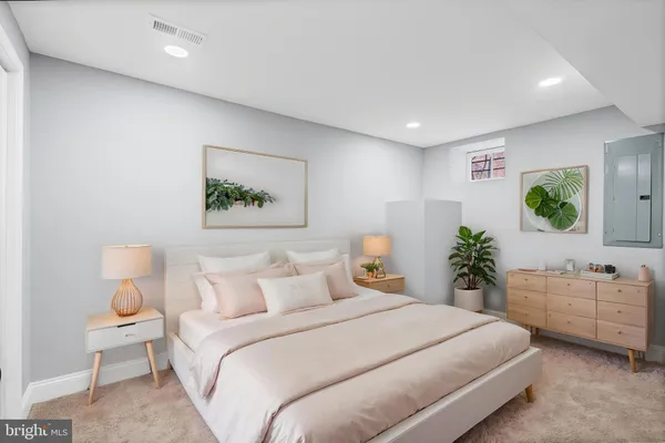 a view of a patio with a bench and trees