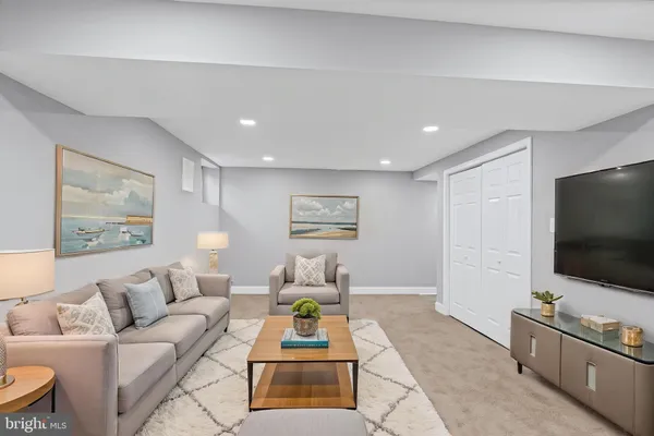 a view of a house with a yard and sitting area