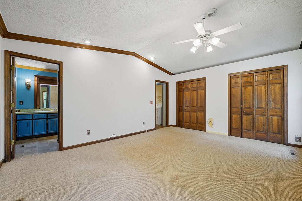20 Sweetwater Trail Jasper, GA 30143 - Photo 19 of 46 an empty room with closet and a chandelier fan