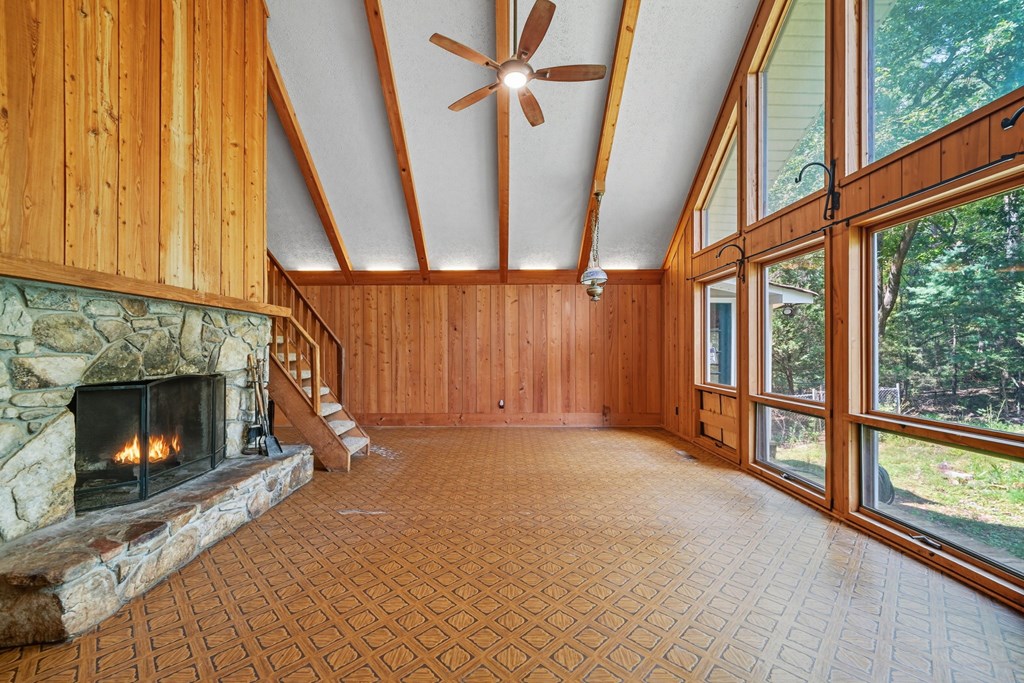 20 Sweetwater Trail Jasper, GA 30143 - Photo 8 of 46 a view of an empty room with wooden floor fireplace and a window
