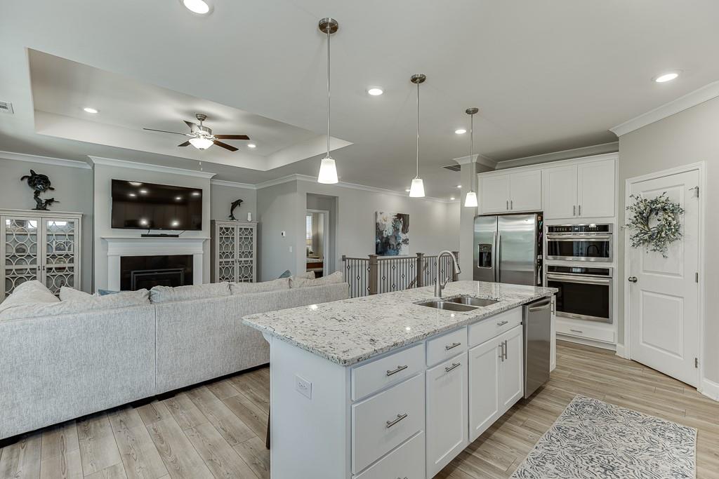 5188 Watchmans Cove Gainesville, GA 30504 - Photo 17 of 90 a kitchen with a sink a counter top stainless steel appliances and cabinets