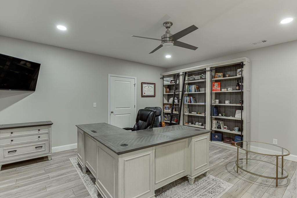 5188 Watchmans Cove Gainesville, GA 30504 - Photo 50 of 90 a living room with furniture and a flat screen tv