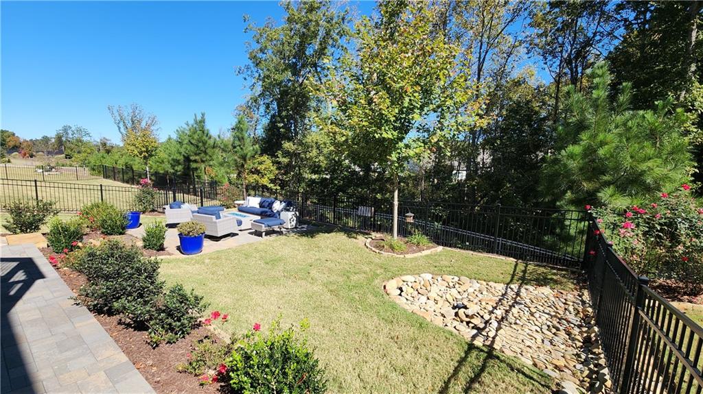 5188 Watchmans Cove Gainesville, GA 30504 - Photo 66 of 90 a view of a backyard with sitting area