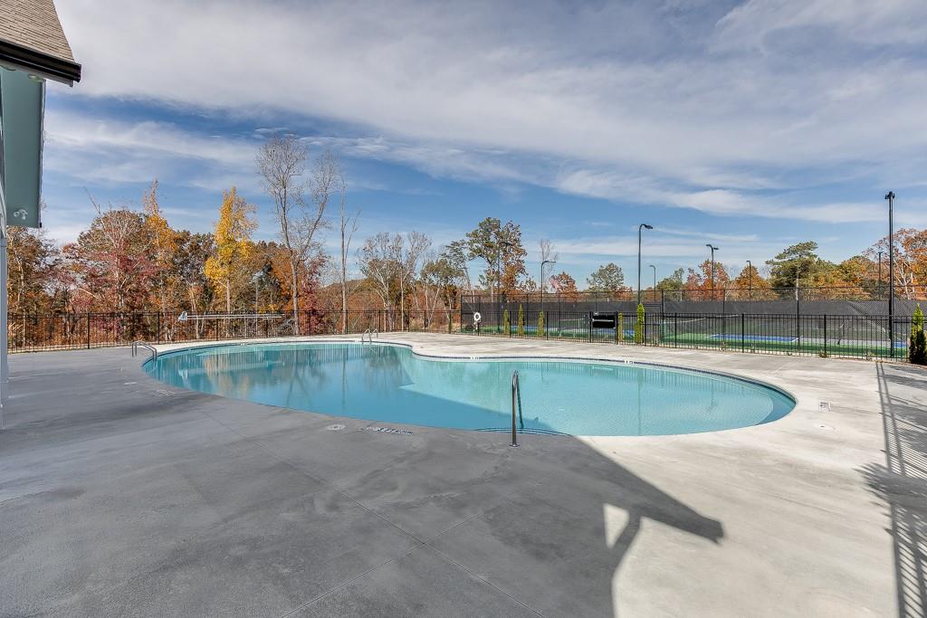 5188 Watchmans Cove Gainesville, GA 30504 - Photo 78 of 90 a view of a swimming pool and a yard