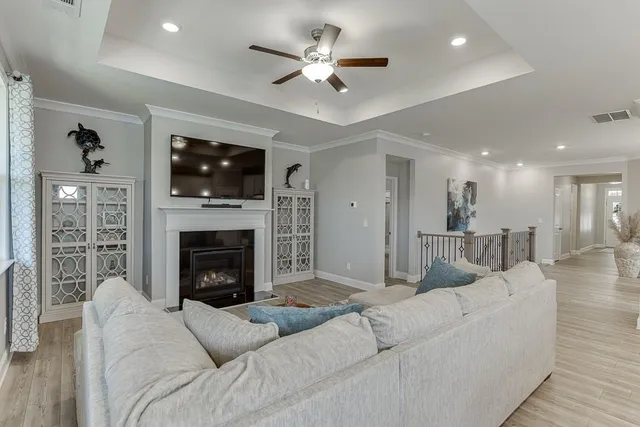 a en suite bathroom with a granite countertop sink and shower