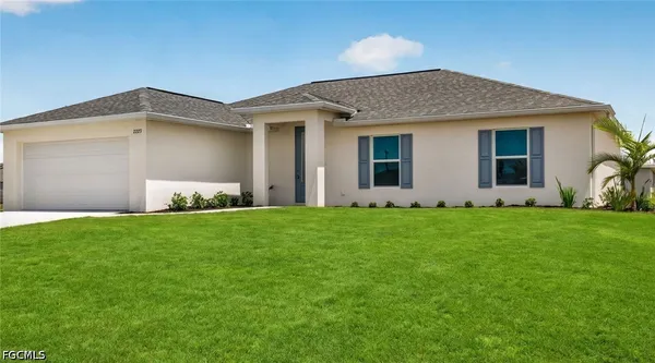 a front view of house with yard and green space