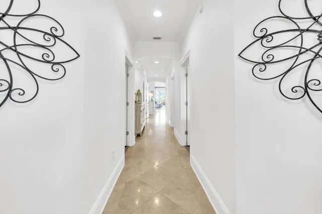 a view of a hallway with windows