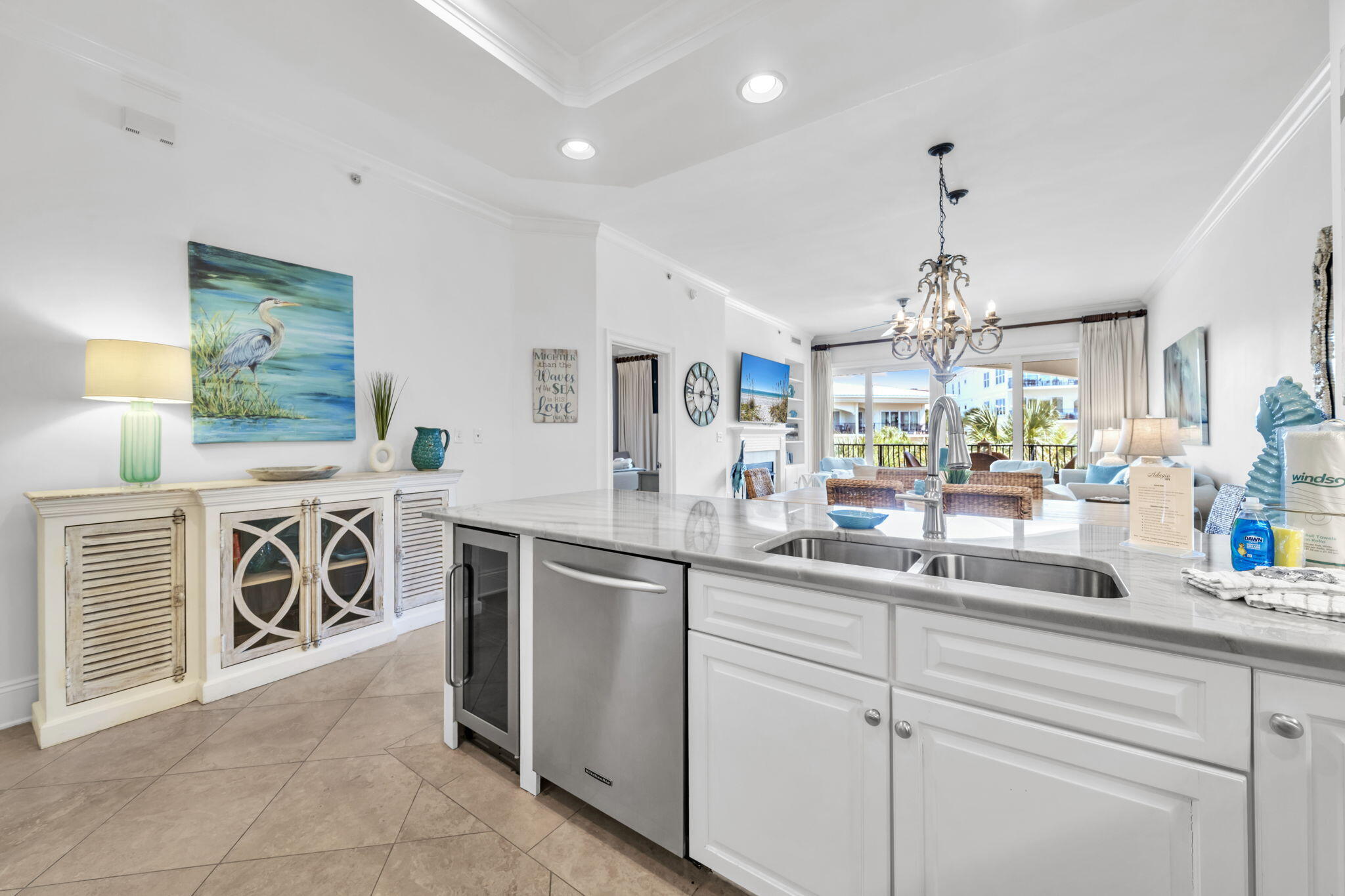 2421 West County Highway 30A, Unit F304 Santa Rosa Beach, FL 32459 - Photo 16 of 63 a kitchen with stainless steel appliances kitchen island granite countertop a sink and cabinets