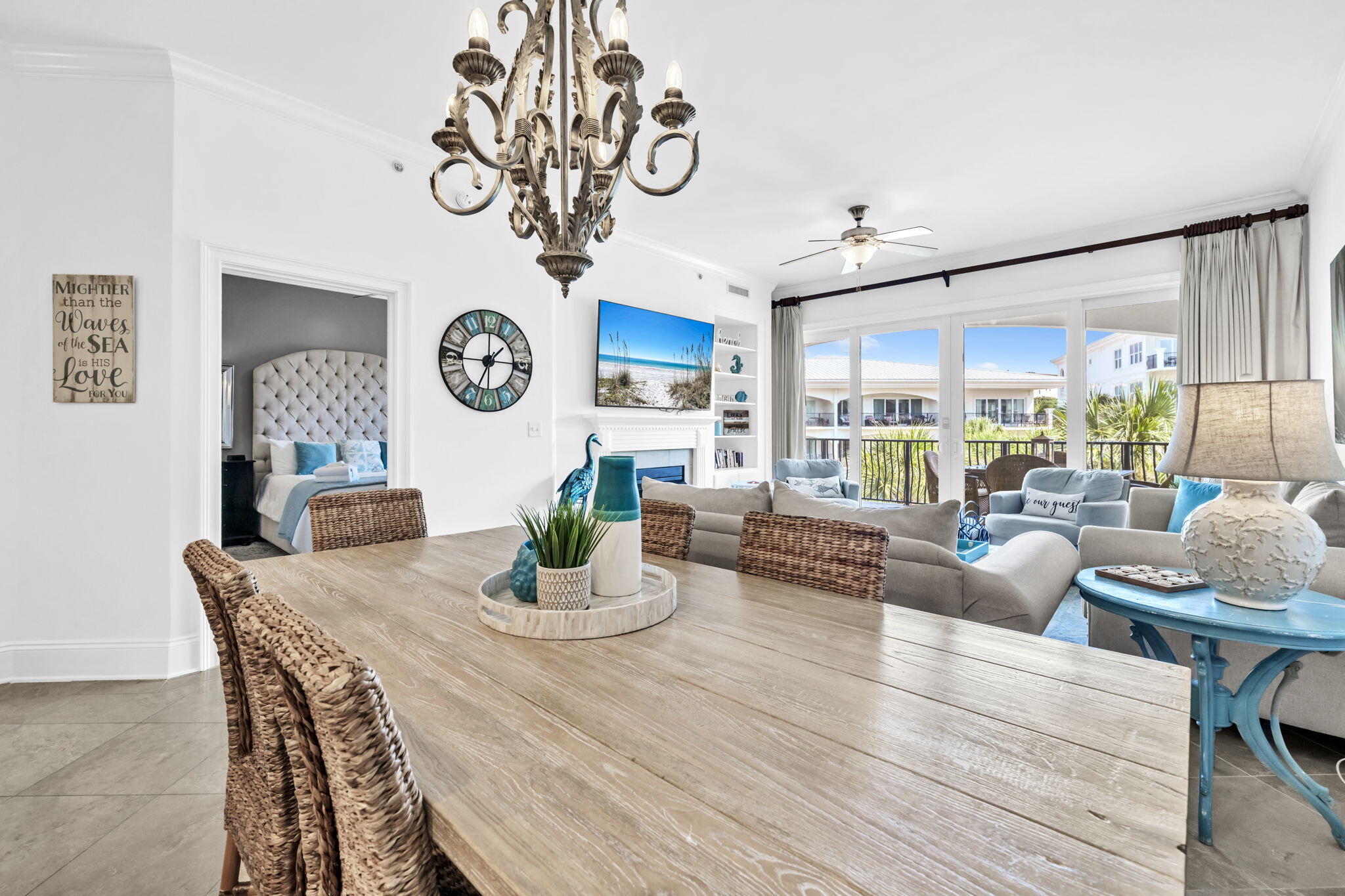 2421 West County Highway 30A, Unit F304 Santa Rosa Beach, FL 32459 - Photo 18 of 63 a view of a dining area with furniture and chandelier