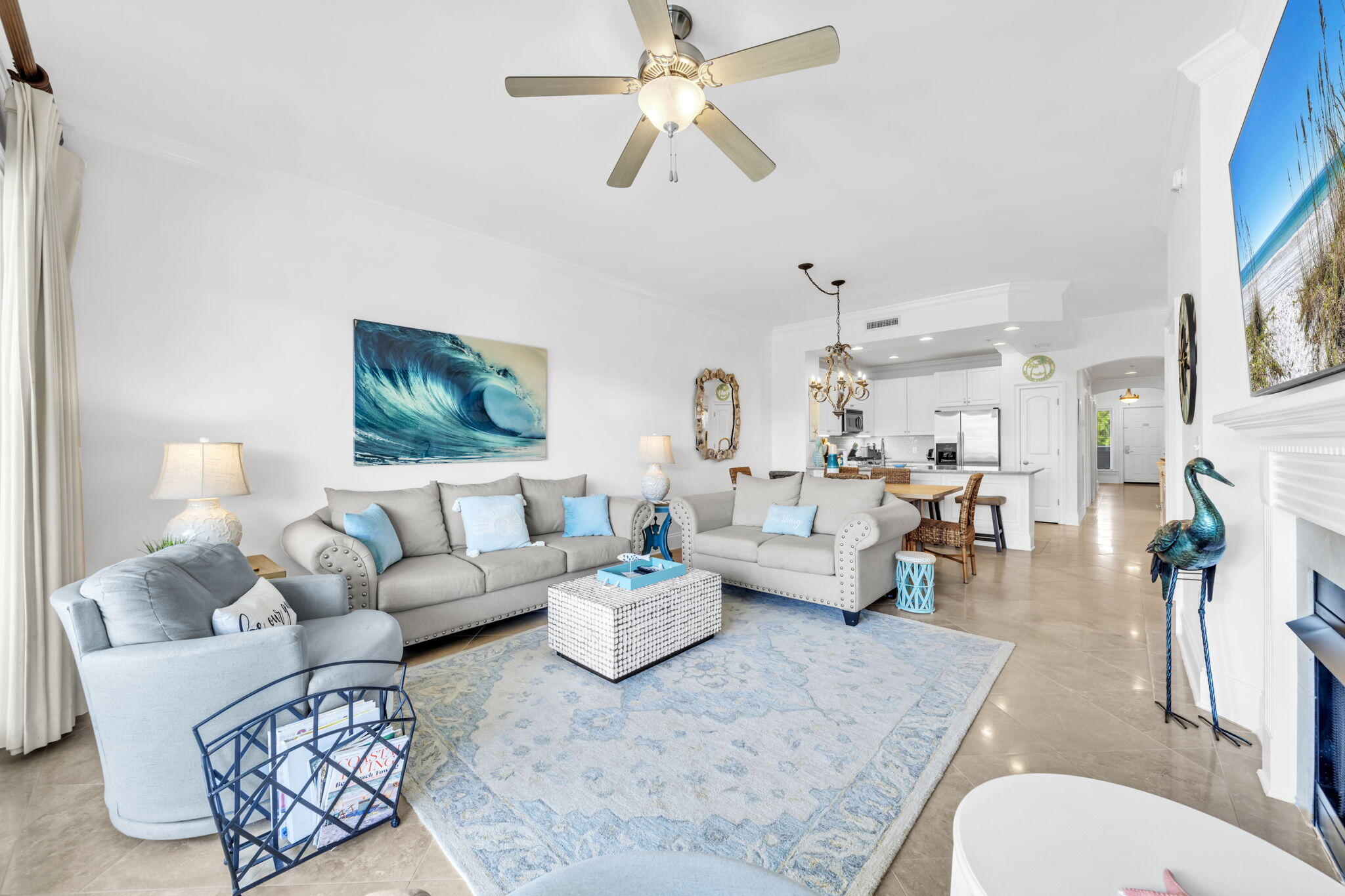 2421 West County Highway 30A, Unit F304 Santa Rosa Beach, FL 32459 - Photo 24 of 63 a living room with furniture and a chandelier