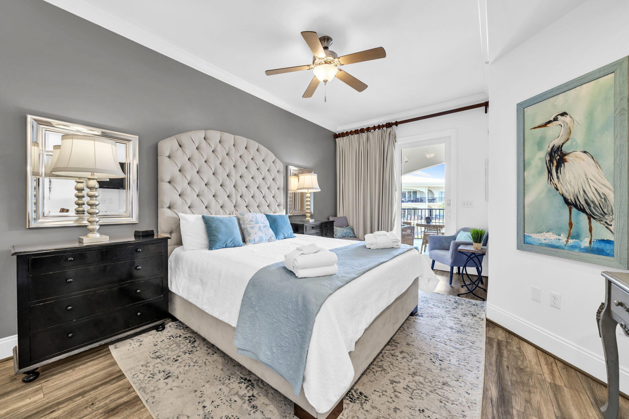 2421 West County Highway 30A, Unit F304 Santa Rosa Beach, FL 32459 - Photo 26 of 63 a bedroom with a bed and a chandelier