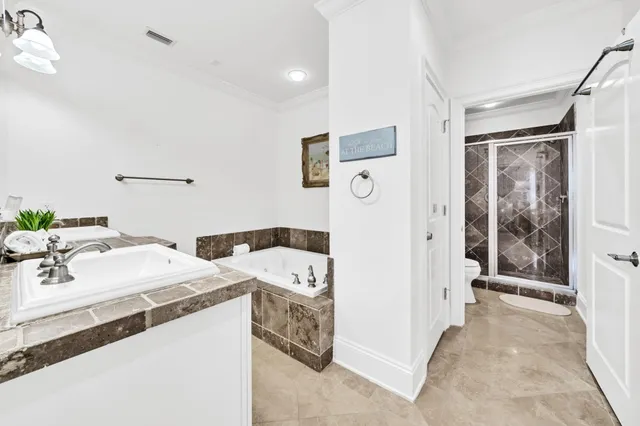 a white toilet sitting next to a shower curtain