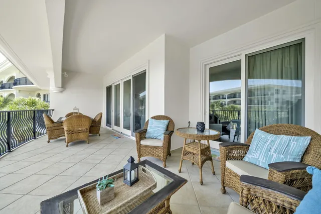 a view of swimming pool with outdoor seating and plants