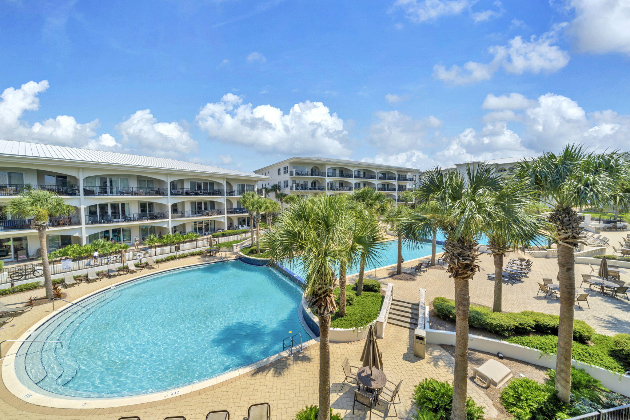2421 West County Highway 30A, Unit F304 Santa Rosa Beach, FL 32459 - Photo 36 of 63 a view of a swimming pool with an outdoor seating and a yard