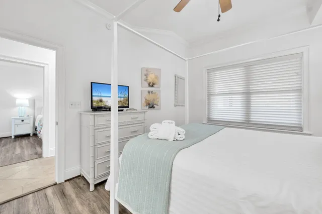 a bedroom with a bed and a television