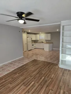a view of a kitchen with wooden floor