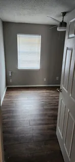 a view of room with window and hardwood