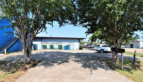 a view of a yard with a tree in the house