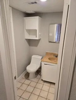 a bathroom with a toilet and a sink