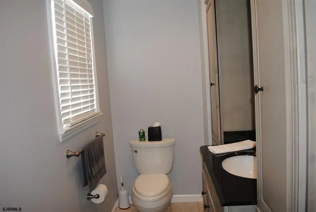a bathroom with a toilet and a sink